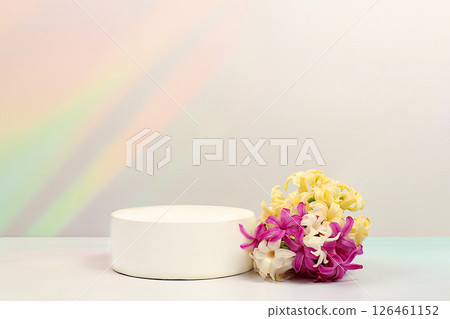 Empty product podium and spring flowers.Abstract flower arrangement with hyacinths, banner.Creative template for your design.Minimal modern aesthetics,elegant beauty concept. Empty product podium and spring flowers.Abstract flower arrangement with hyacinths, banner.Creative template for your design.Minimal modern aesthetics,elegant beauty concept. 126461152