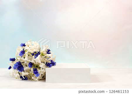 Empty product podium and spring flowers.Abstract flower arrangement with hyacinths, banner.Creative template for your design.Minimal modern aesthetics,elegant beauty concept. 126461153