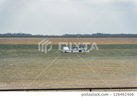 The meeting of the blue waters of the Tapajos River and muddy of the Amazon River in Santarem, Para State, Brazil. 126461406