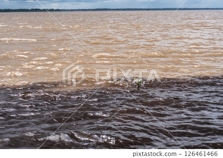 Meeting of the waters of the Negro and Solimoes rivers in the city of Manaus in Amazonia, Brazil 126461466