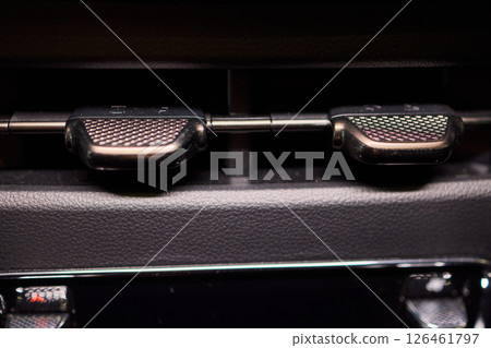 Closeup of car dashboard air vents near gear shift 126461797