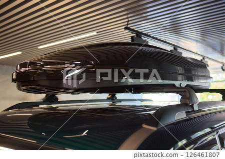 A Roof Box Mounted on Your Vehicle for Enhanced Storage Solutions and Travel Convenience A Roof Box Mounted on Your Vehicle for Enhanced Storage Solutions and Travel Convenience 126461807