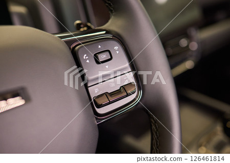 The modern cars steering wheel control panel boosts convenience and performance The modern cars steering wheel control panel boosts convenience and performance 126461814