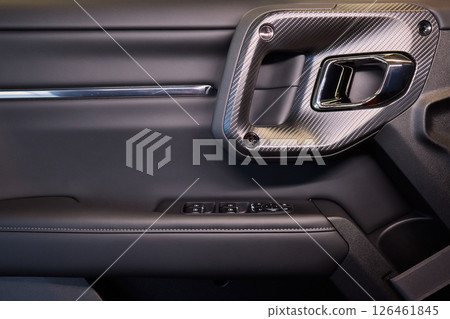 A car door with trim showcasing automotive design details A car door with trim showcasing automotive design details 126461845