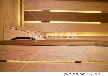 Experience the Cozy Wooden Sauna Interior Equipped with Inviting Warm Lighting and Ambiance Experience the Cozy Wooden Sauna Interior Equipped with Inviting Warm Lighting and Ambiance 126462196