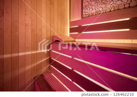 Experience the Cozy Wooden Sauna Interior Equipped with Inviting Warm Lighting and Ambiance Experience the Cozy Wooden Sauna Interior Equipped with Inviting Warm Lighting and Ambiance 126462210