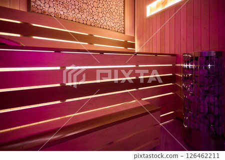 Experience the Cozy Wooden Sauna Interior Equipped with Inviting Warm Lighting and Ambiance Experience the Cozy Wooden Sauna Interior Equipped with Inviting Warm Lighting and Ambiance 126462211