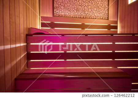 Experience the Cozy Wooden Sauna Interior Equipped with Inviting Warm Lighting and Ambiance Experience the Cozy Wooden Sauna Interior Equipped with Inviting Warm Lighting and Ambiance 126462212