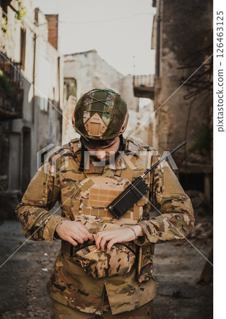 Soldier Puts On Gloves Before Starting The Operation In The City 126463125
