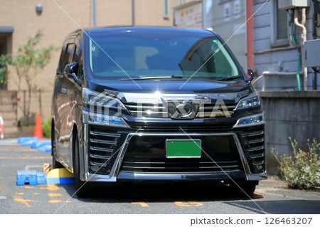 Parked black minivan Parked black minivan 126463207