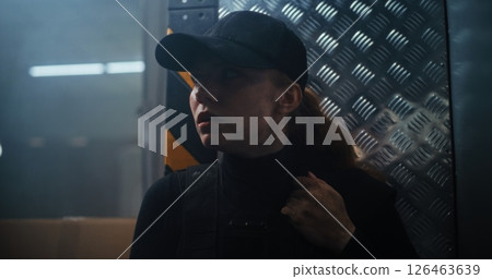 Action Movie Scene: Female Police Officer Hiding Behind the Wall, Holding a Gun 126463639