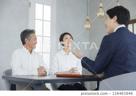 Salesman, senior and family having a meeting Salesman, senior and family having a meeting 126463846