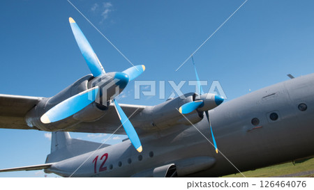 A close look at a vintage Soviet aircraft with blue propellers showcases its design during a Russian aviation event, evoking nostalgia for aviation history. A close look at a vintage Soviet aircraft with blue propellers showcases its design during a Russian aviation event, evoking nostalgia for aviation history. 126464076