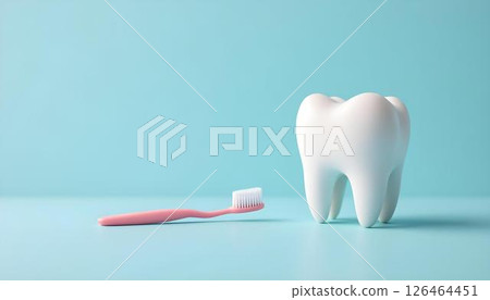 A toothbrush and a tooth placed on a blue surface, symbolizing dental care and oral hygiene 126464451