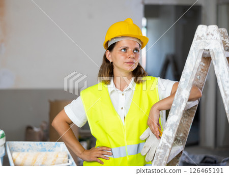 Portrait of young woman builder 126465191