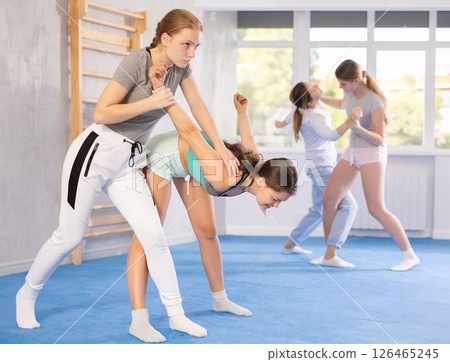 Females practicing self defence moves 126465245