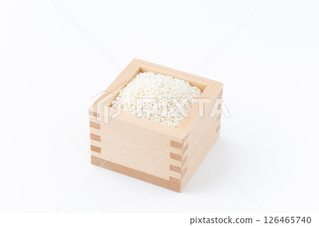 Glutinous rice in a wooden box on a white background Glutinous rice in a wooden box on a white background 126465740