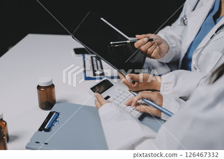 doctors and nurse having informal meeting in hospital canteen doctors and nurse having informal meeting in hospital canteen 126467332