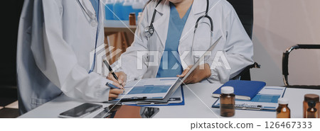 doctors and nurse having informal meeting in hospital canteen 126467333