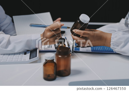 doctors and nurse having informal meeting in hospital canteen 126467350