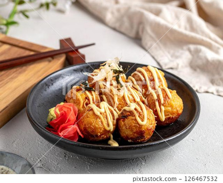 Modern Japanese style takoyaki served on a plate 126467532