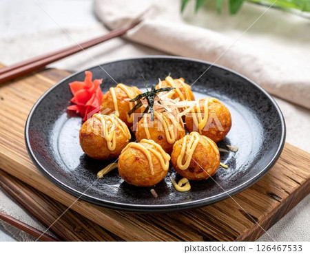 Modern Japanese style takoyaki served on a plate 126467533