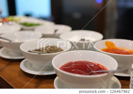 bowls of various dip sauces, top view different sauces and ingredients on gray background, flat lay. Space for text 126467962