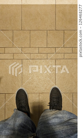 Point of View Black Sneakers, Blue Jeans and Tile Floor in Earth Tones, Casual Wear 126468277