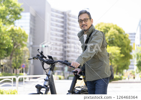 A man in his late 50s smiling at the camera 126468364