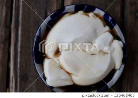 Crumbled Jimami tofu served on a small Yachimun plate 126468403