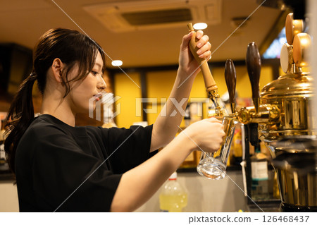 Female staff working at a restaurant 126468437