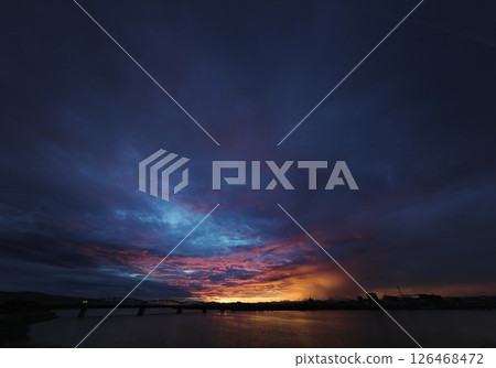 Dramatic dawn sky with a variety of clouds and colorful morning glow, Autumn, ultra-wide angle, sky-focused, 241007am Dramatic dawn sky with a variety of clouds and colorful morning glow, Autumn, ultra-wide angle, sky-focused, 241007am 126468472