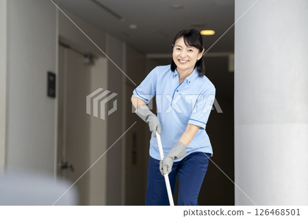 Female cleaning staff in her 50s looking at camera, portrait 126468501