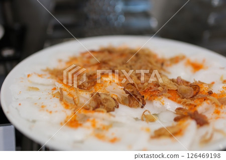 Vietnamese steamed cakes Banh day in Vietnamese. Sticky rice cake wit mung bean, cover with scallions oil Vietnamese steamed cakes Banh day in Vietnamese. Sticky rice cake wit mung bean, cover with scallions oil 126469198