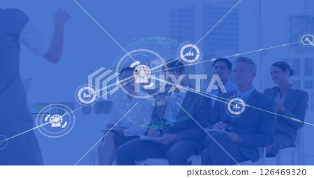 Image of network of connections with icons over diverse businesspeople in office Image of network of connections with icons over diverse businesspeople in office 126469320