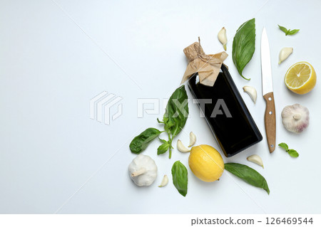 The concept of Italian cuisine, olive oil, on a light background. The concept of Italian cuisine, olive oil, on a light background. 126469544