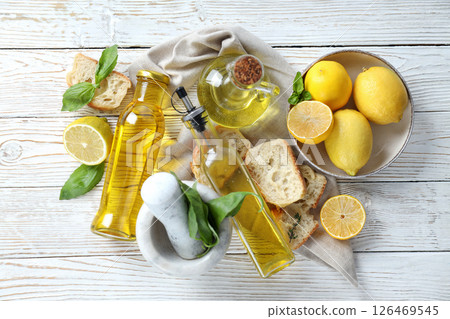 The concept of Italian cuisine, olive oil, on a light background. 126469545