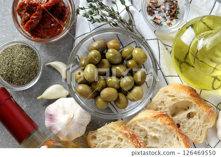The concept of Italian cuisine, a plate with olives. The concept of Italian cuisine, a plate with olives. 126469550