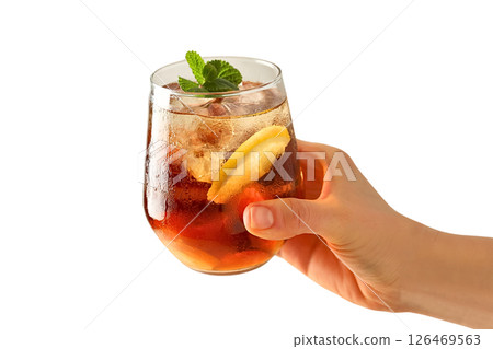Hand holds a chilled iced tea drink with lemon and mint, isolated on white Hand holds a chilled iced tea drink with lemon and mint, isolated on white 126469563