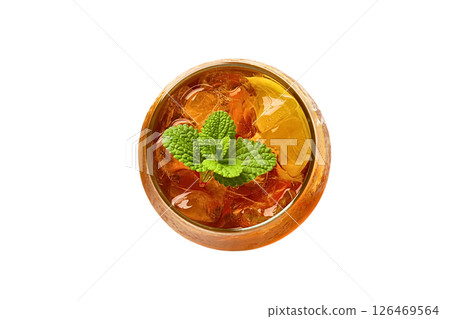 A glass filled with iced tea features fresh mint leaves on top, isolated on white A glass filled with iced tea features fresh mint leaves on top, isolated on white 126469564