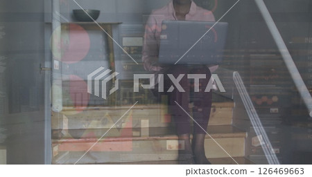 Image of data processing over african american woman using laptop Image of data processing over african american woman using laptop 126469663