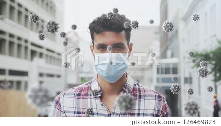 Image of virus cells over biracial man wearing face mask Image of virus cells over biracial man wearing face mask 126469823