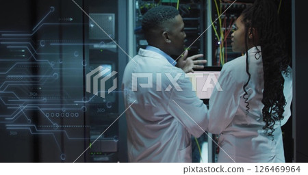 Image of data processing and african american it technicians with laptop by computer servers 126469964