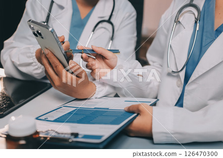 doctors and nurse having informal meeting in hospital canteen 126470300