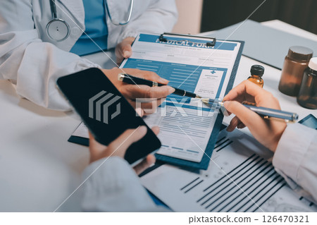 doctors and nurse having informal meeting in hospital canteen 126470321