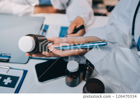 doctors and nurse having informal meeting in hospital canteen 126470334