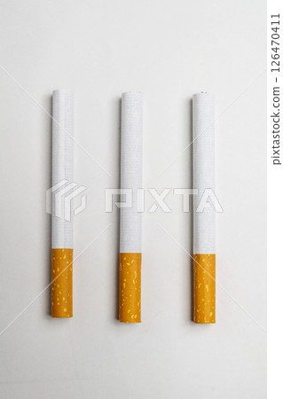 Cigarettes, rolled tobacco in paper with a filter tube, isolated on a white background. No or quit smoking, a bad habit, and unhealthy Cigarettes, rolled tobacco in paper with a filter tube, isolated on a white background. No or quit smoking, a bad habit, and unhealthy 126470411