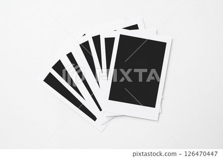 A stack of blank polaroid photo papers on a white background. Mockup, template, or copy space. Instant camera photo print frame A stack of blank polaroid photo papers on a white background. Mockup, template, or copy space. Instant camera photo print frame 126470447