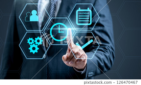 Businessman touches the icon of the clock on the productivity scheme. Technology innovation on the virtual screen. Concept of plan and time management 126470467