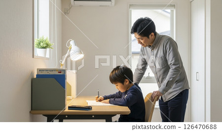 Parents supporting their children's learning 126470688